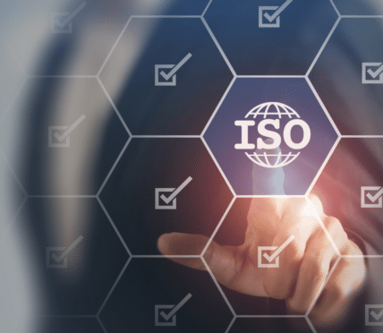 A person in a suit is pressing a virtual hexagonal button labelled ISO with a globe icon, surrounded by tick marks on a digital interface—illustrating the modernisation of law enforcement technology in Northwestern Ontario.