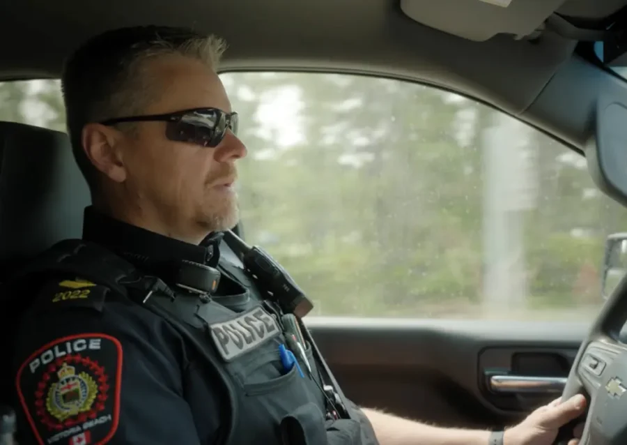 Victoria Beach Police Service officer seated in a patrol vehicle on patrol